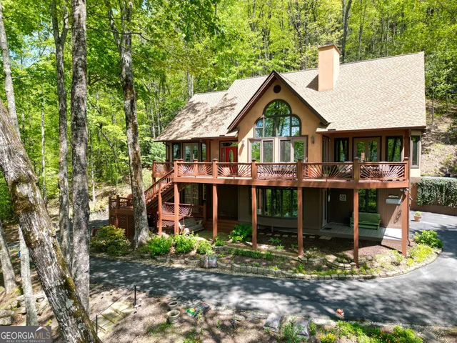 a view of a livingroom with furniture and staircase
