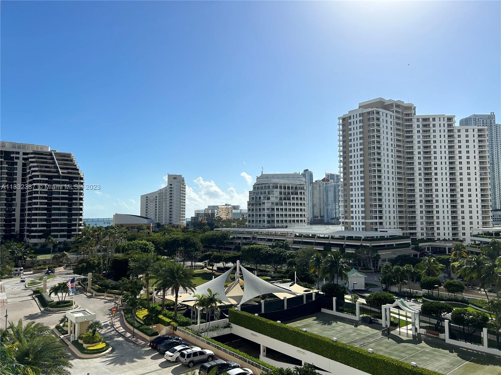 888 Brickell Key Drive, Unit 802 Miami, FL 33131 - Photo 14 of 42 a view of a city with tall buildings