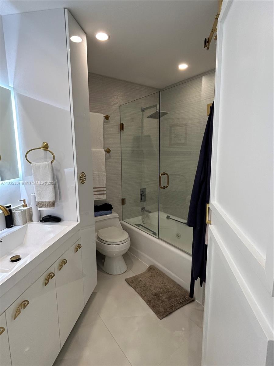 888 Brickell Key Drive, Unit 802 Miami, FL 33131 - Photo 24 of 42 a bathroom with a sink a toilet and shower