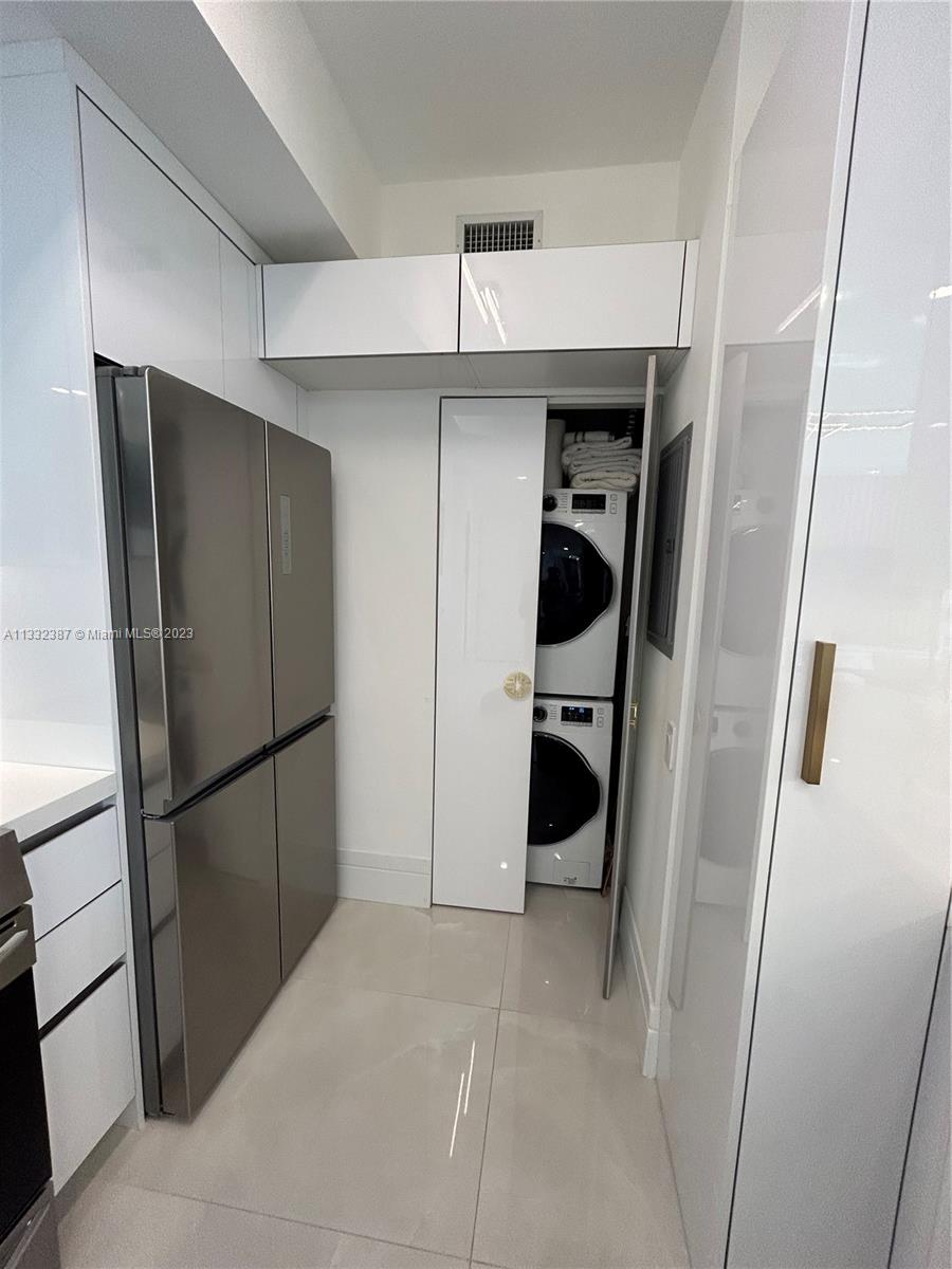 888 Brickell Key Drive, Unit 802 Miami, FL 33131 - Photo 33 of 42 a view of a refrigerator in kitchen and a hallway