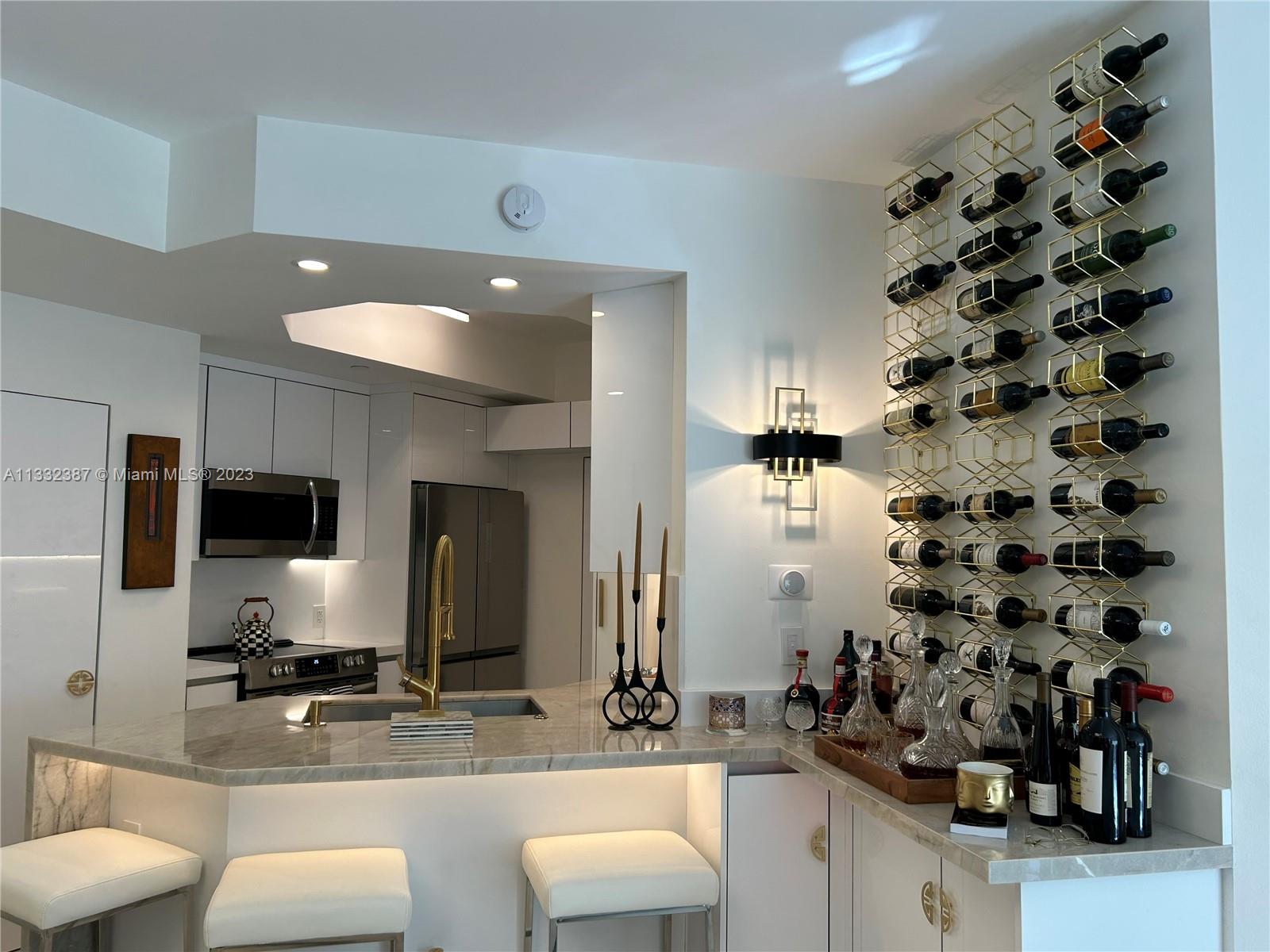 888 Brickell Key Drive, Unit 802 Miami, FL 33131 - Photo 37 of 42 a bathroom with a sink double vanity and a mirror