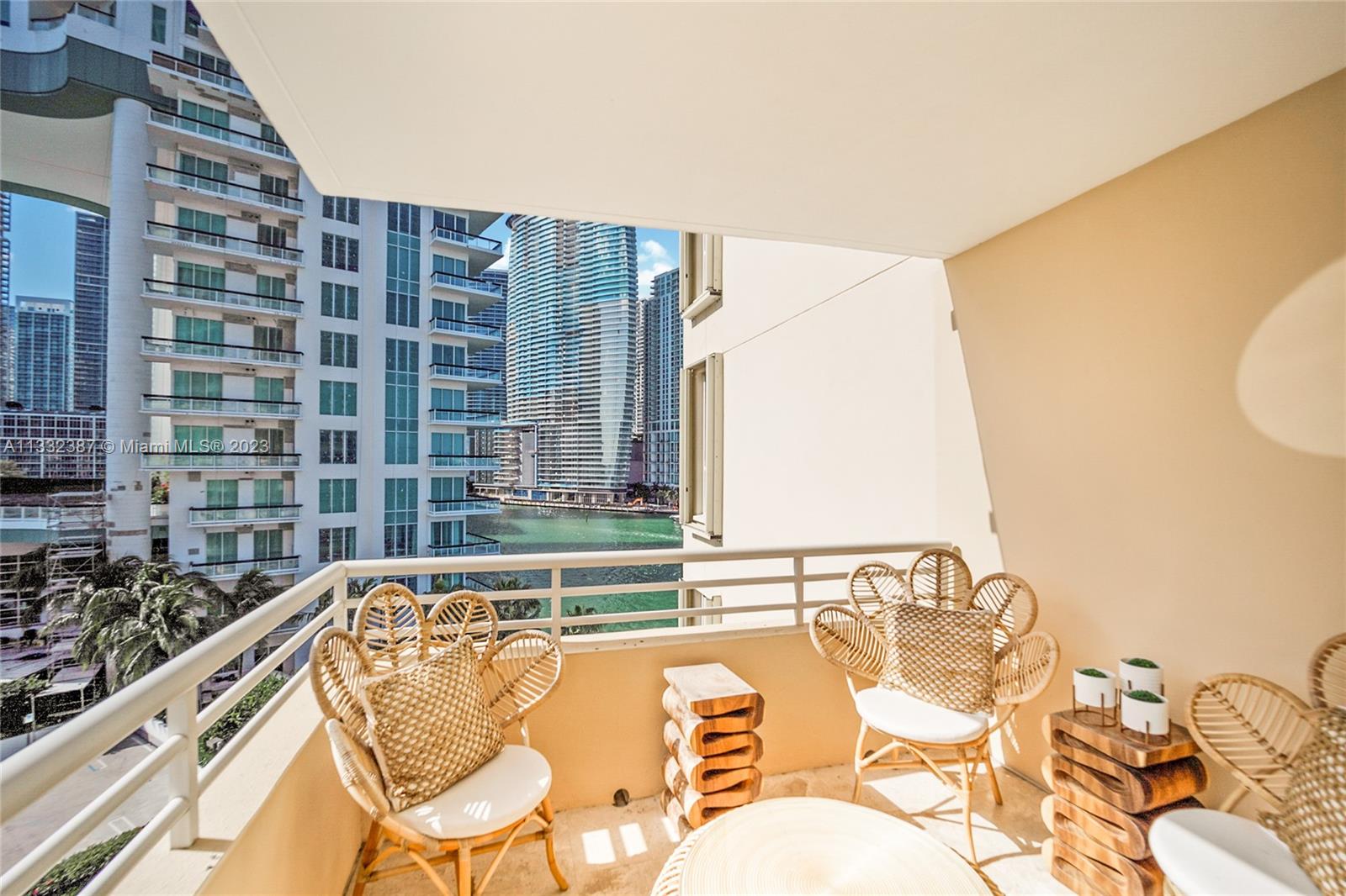888 Brickell Key Drive, Unit 802 Miami, FL 33131 - Photo 9 of 42 a view of a swimming pool with a lounge chair