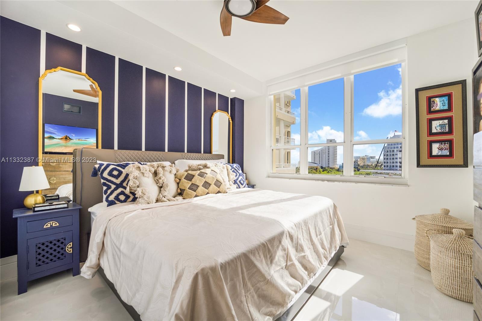 888 Brickell Key Drive, Unit 802 Miami, FL 33131 - Photo 10 of 42 a bedroom with a bed and painting on the wall