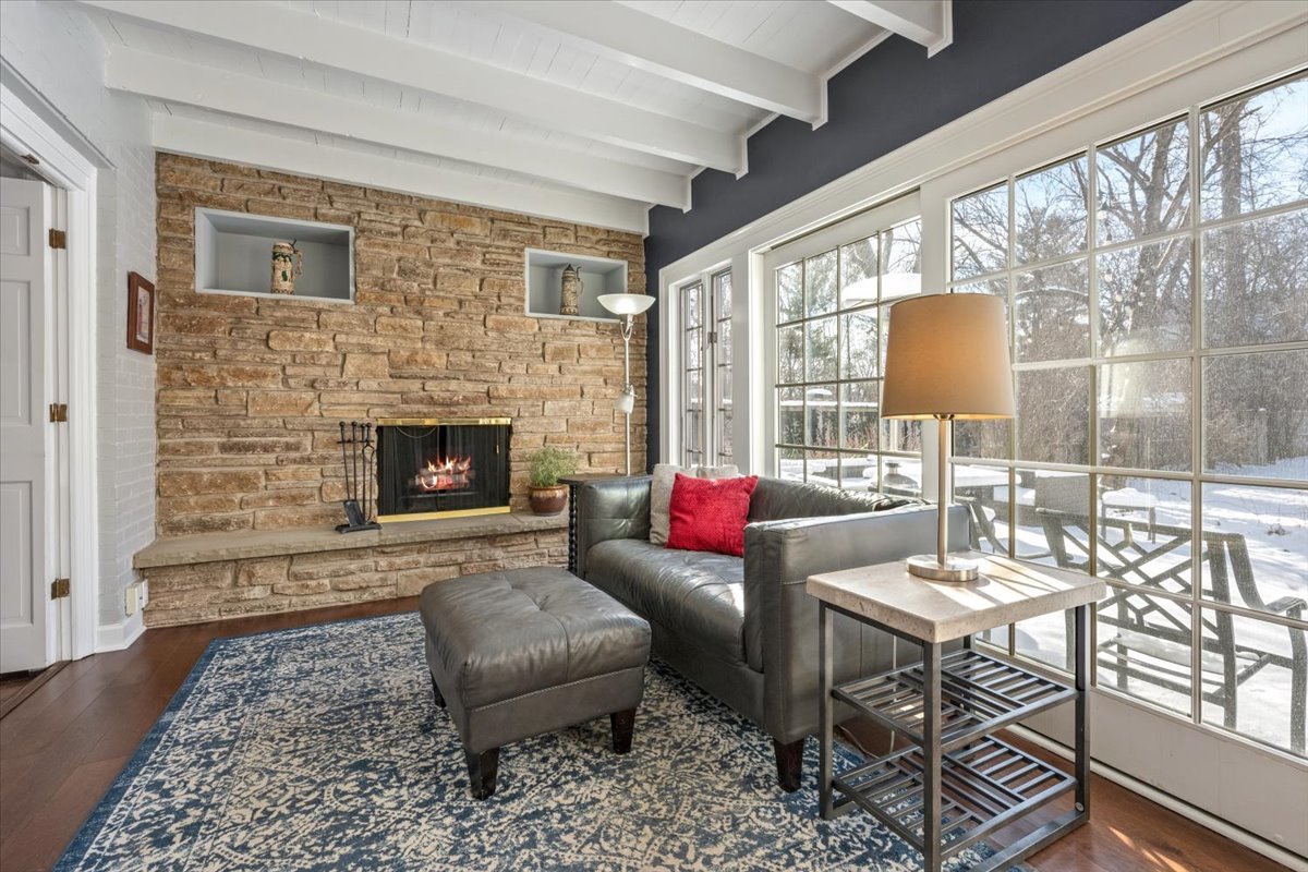 909 Locust Road Wilmette, IL 60091 - Photo 11 of 45 a living room with furniture and a fireplace