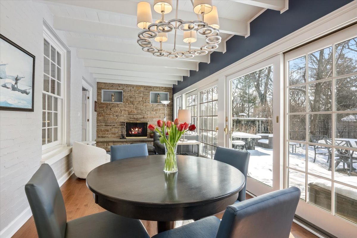 909 Locust Road Wilmette, IL 60091 - Photo 13 of 45 a dining room with furniture a livingroom and chandelier