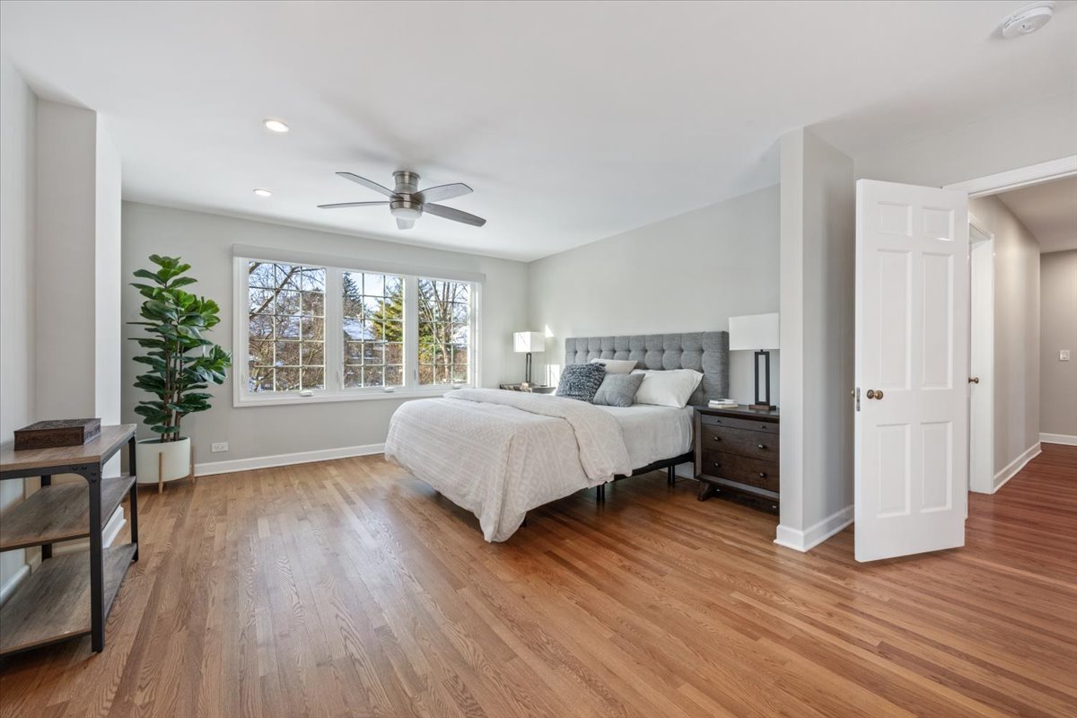 909 Locust Road Wilmette, IL 60091 - Photo 20 of 45 a bedroom with a bed and a large window