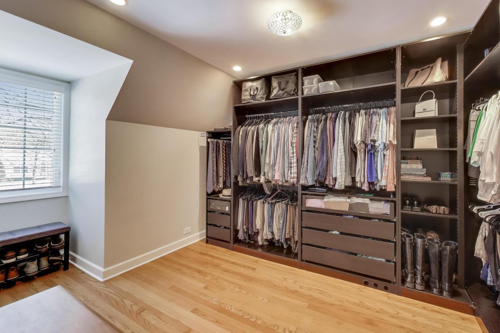 909 Locust Road Wilmette, IL 60091 - Photo 26 of 45 walk in closet with clothes and shoes