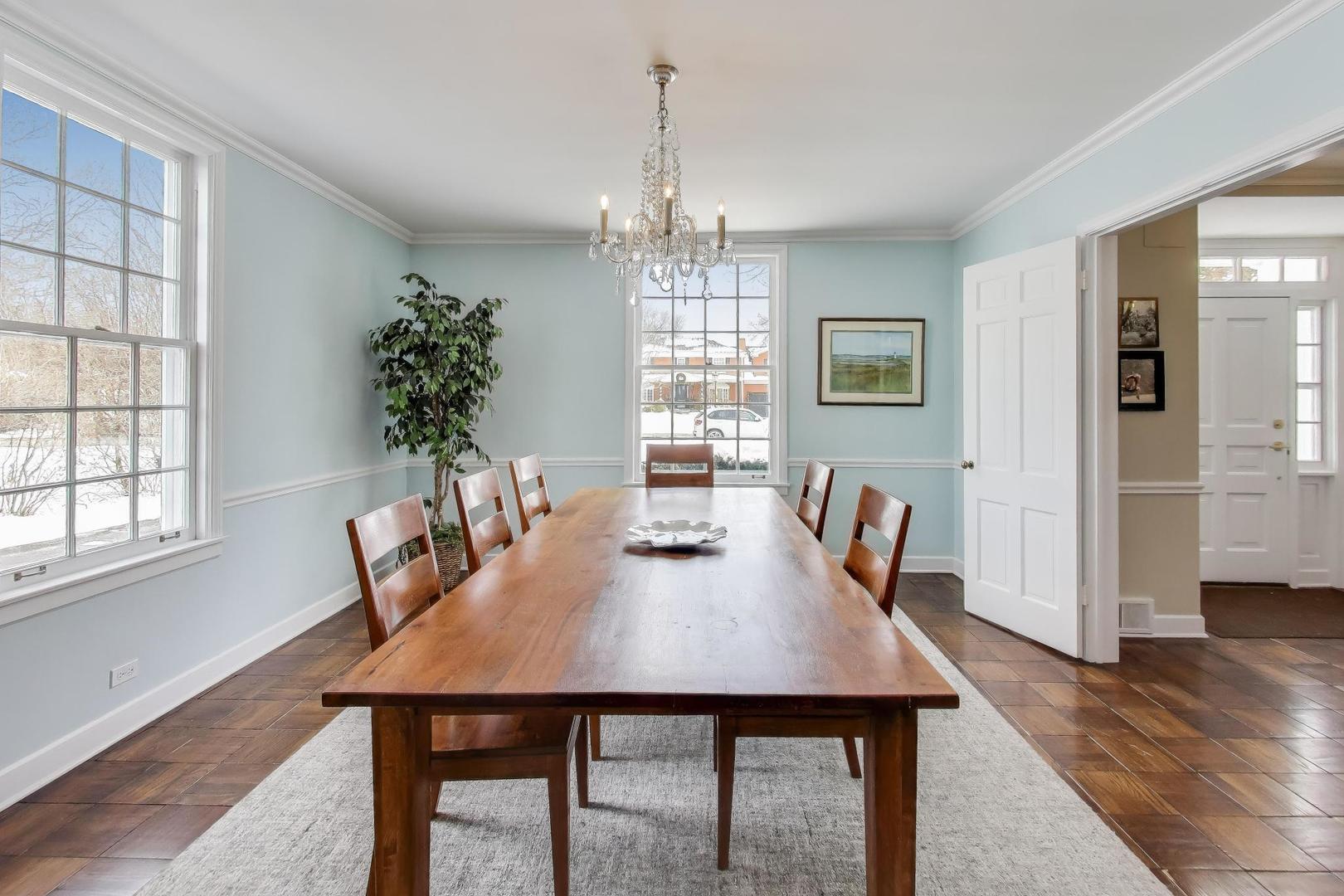 909 Locust Road Wilmette, IL 60091 - Photo 5 of 45 a view of a dining room with furniture window and wooden floor