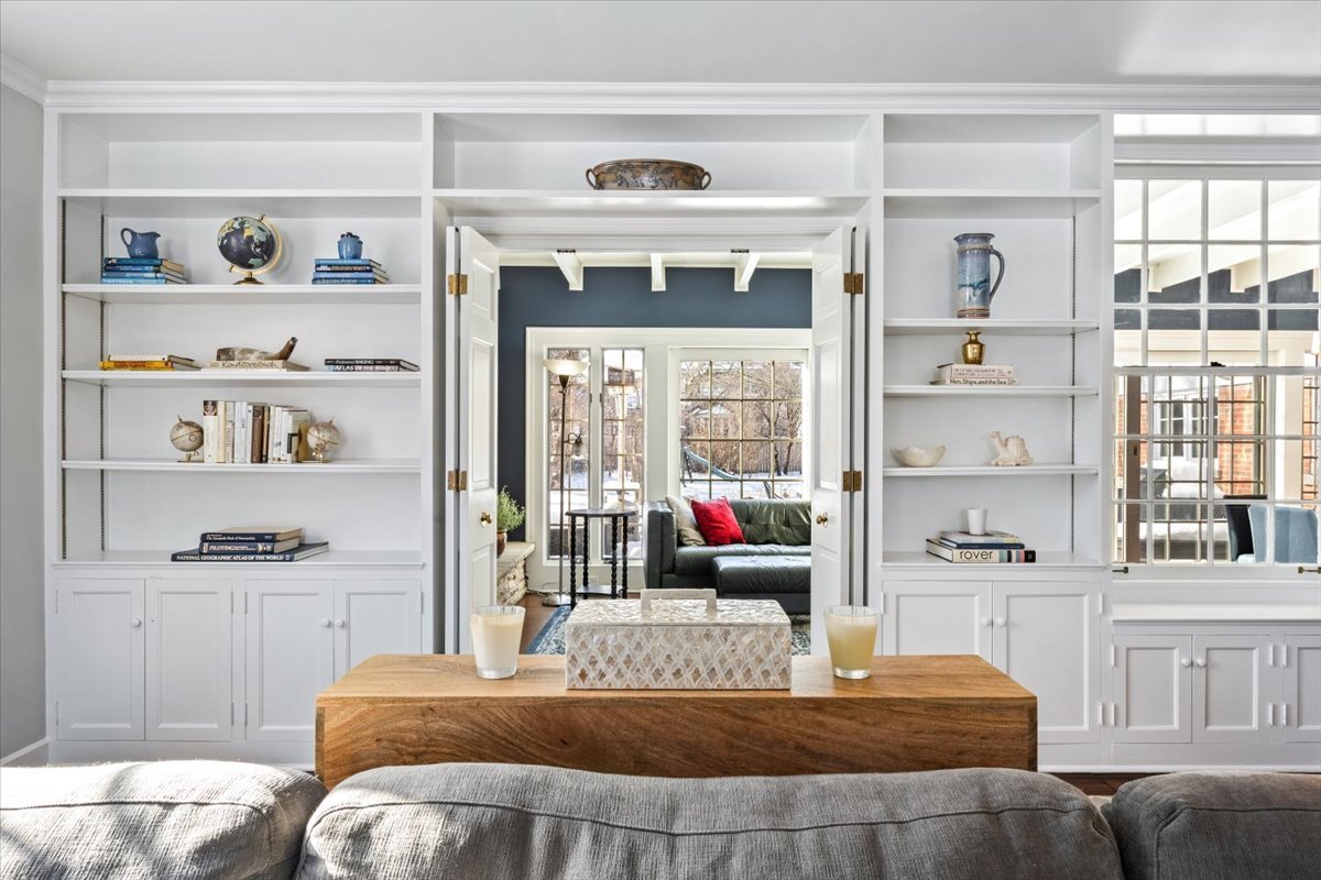 909 Locust Road Wilmette, IL 60091 - Photo 9 of 45 a bedroom with a bed a large window with the outer view and mirror