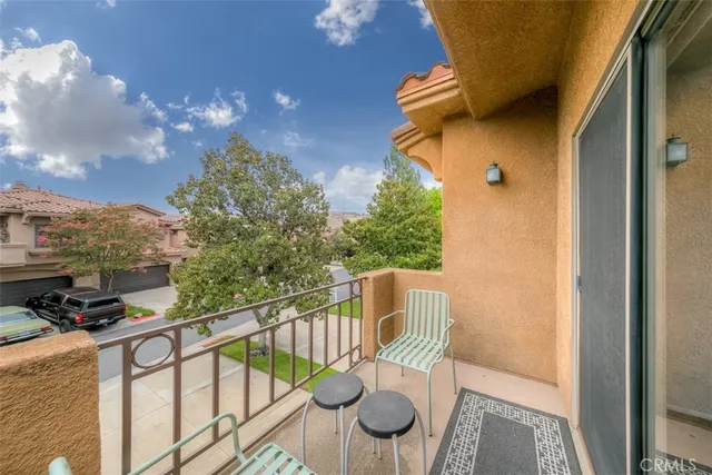 a view of balcony with furniture