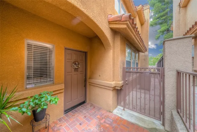 a view of a wooden door and a window
