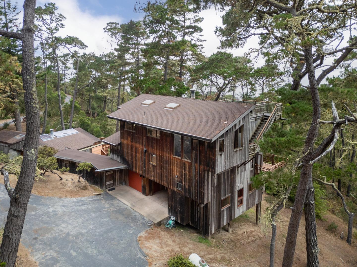 73 Mt Devon Road Carmel Highlands, CA 93923 - Photo 83 of 88 an aerial view of a house with a yard table and chairs