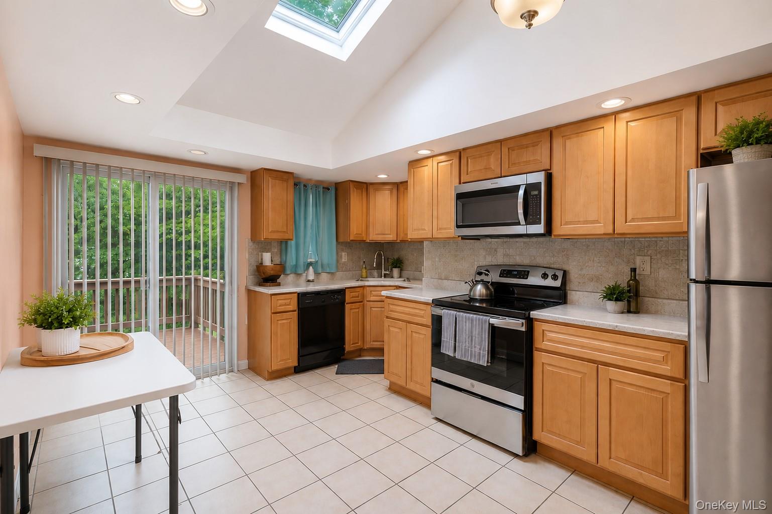 1 Windsor Road Monroe, NY 10950 - Photo 6 of 20 a kitchen with a refrigerator a stove a sink dishwasher and wooden cabinets with wooden floor