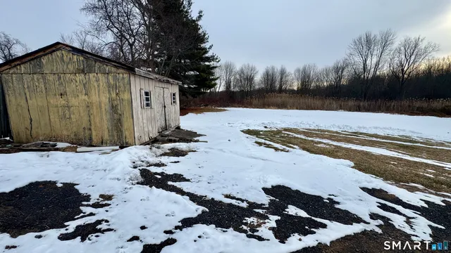 a view of a backyard of a house