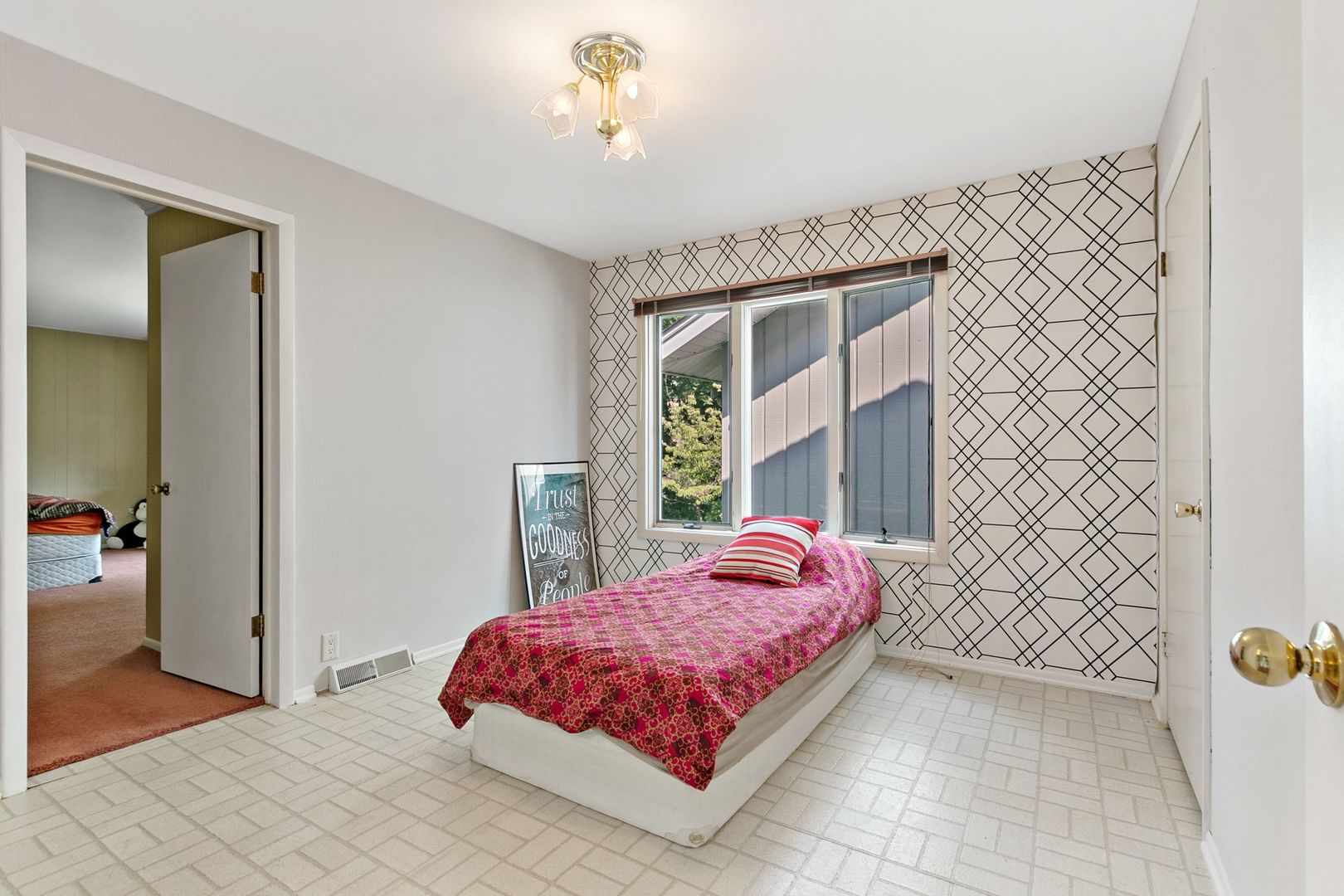 905 Ridge Avenue Wauconda, IL 60084 - Photo 12 of 27 a bedroom with a bed and a chandelier
