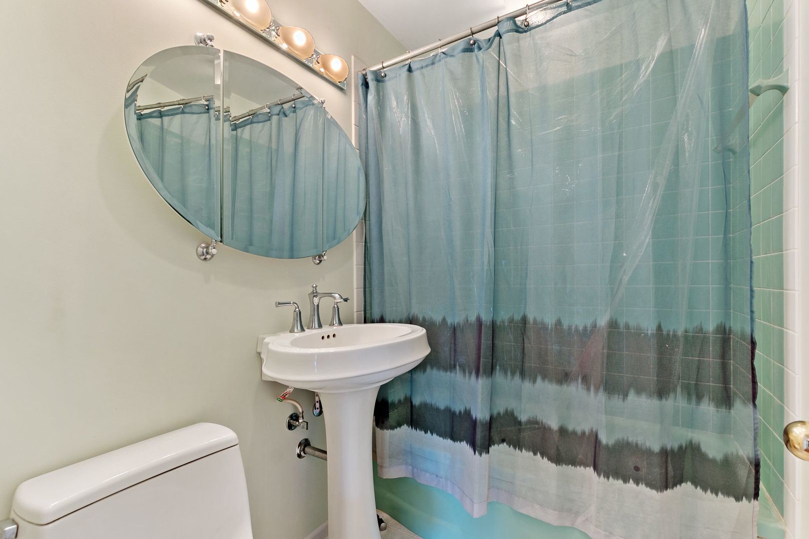 905 Ridge Avenue Wauconda, IL 60084 - Photo 13 of 27 a bathroom with a sink a toilet and shower