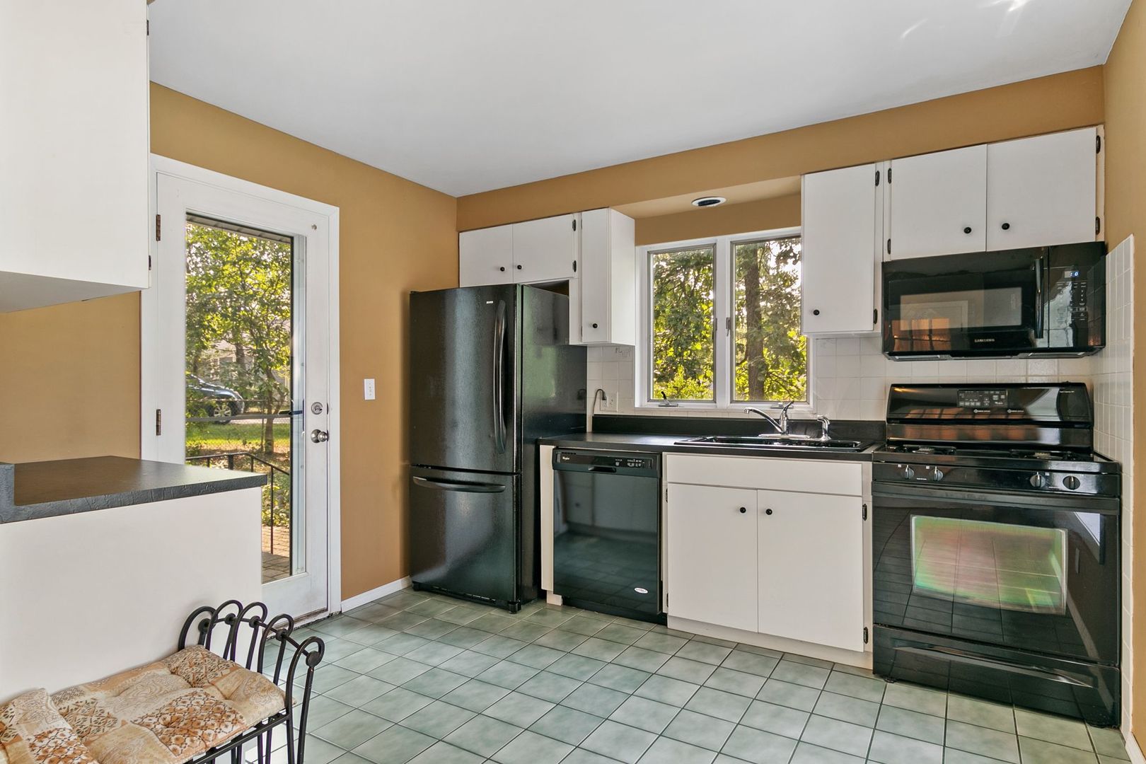 905 Ridge Avenue Wauconda, IL 60084 - Photo 17 of 27 a kitchen with a refrigerator stove and sink