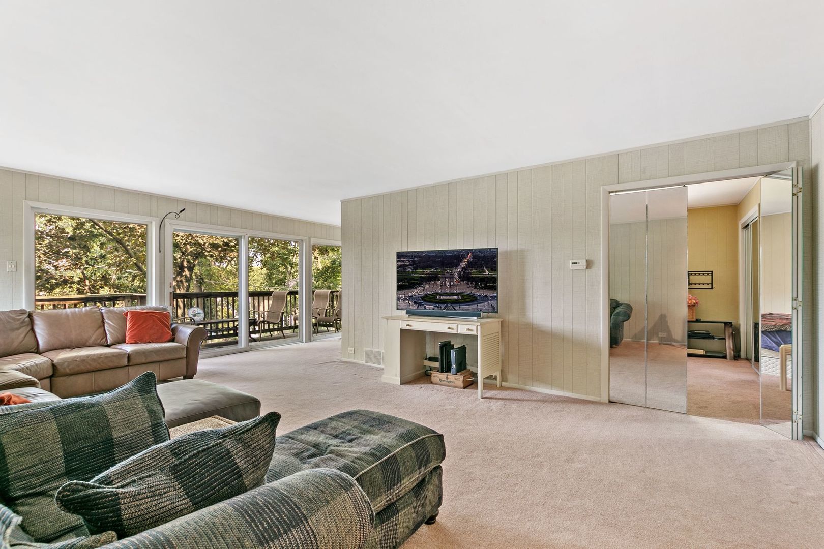 905 Ridge Avenue Wauconda, IL 60084 - Photo 22 of 27 a living room with furniture a flat screen tv and a large window