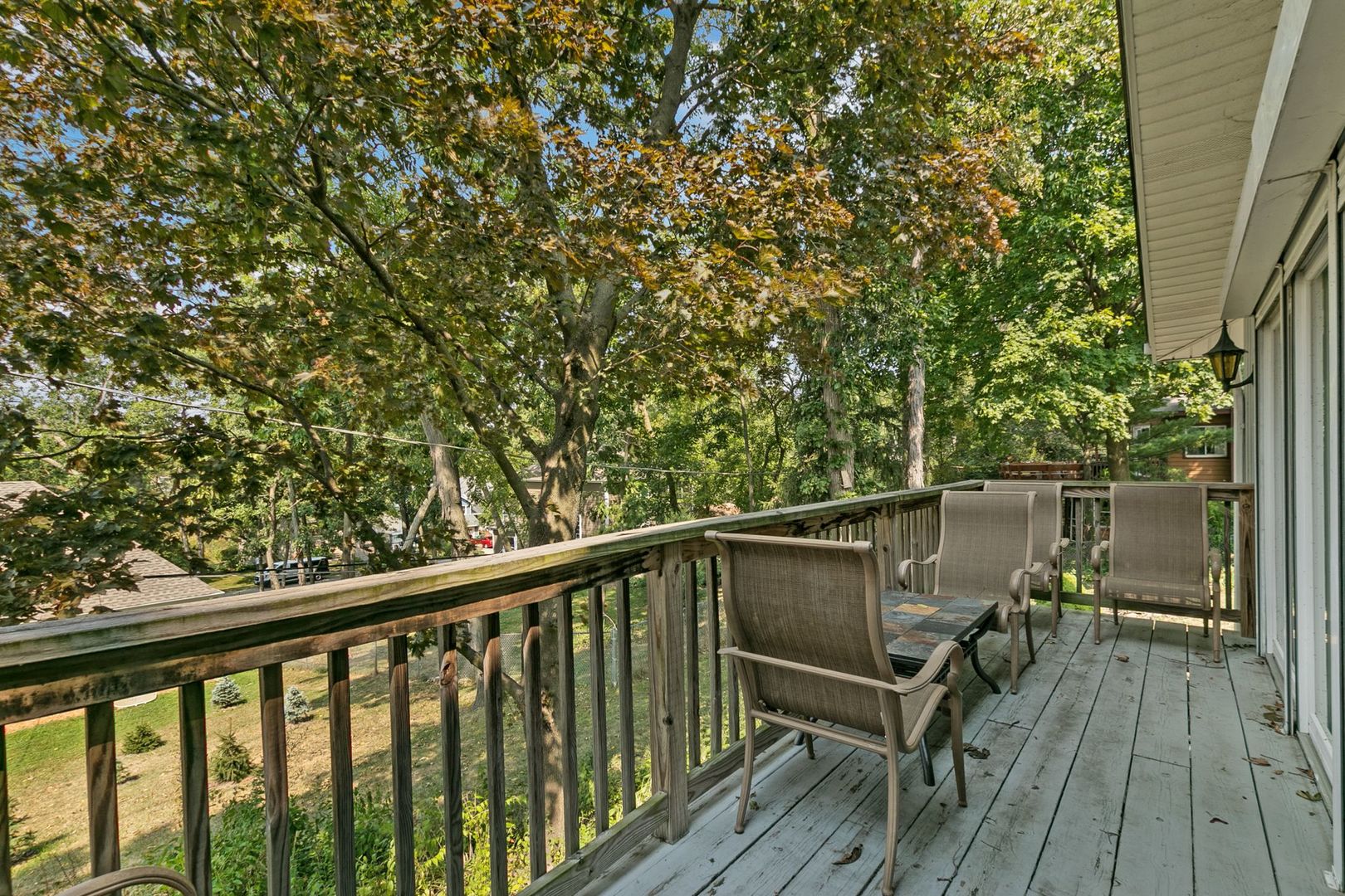 905 Ridge Avenue Wauconda, IL 60084 - Photo 6 of 27 a view of a balcony with wooden floor and bench
