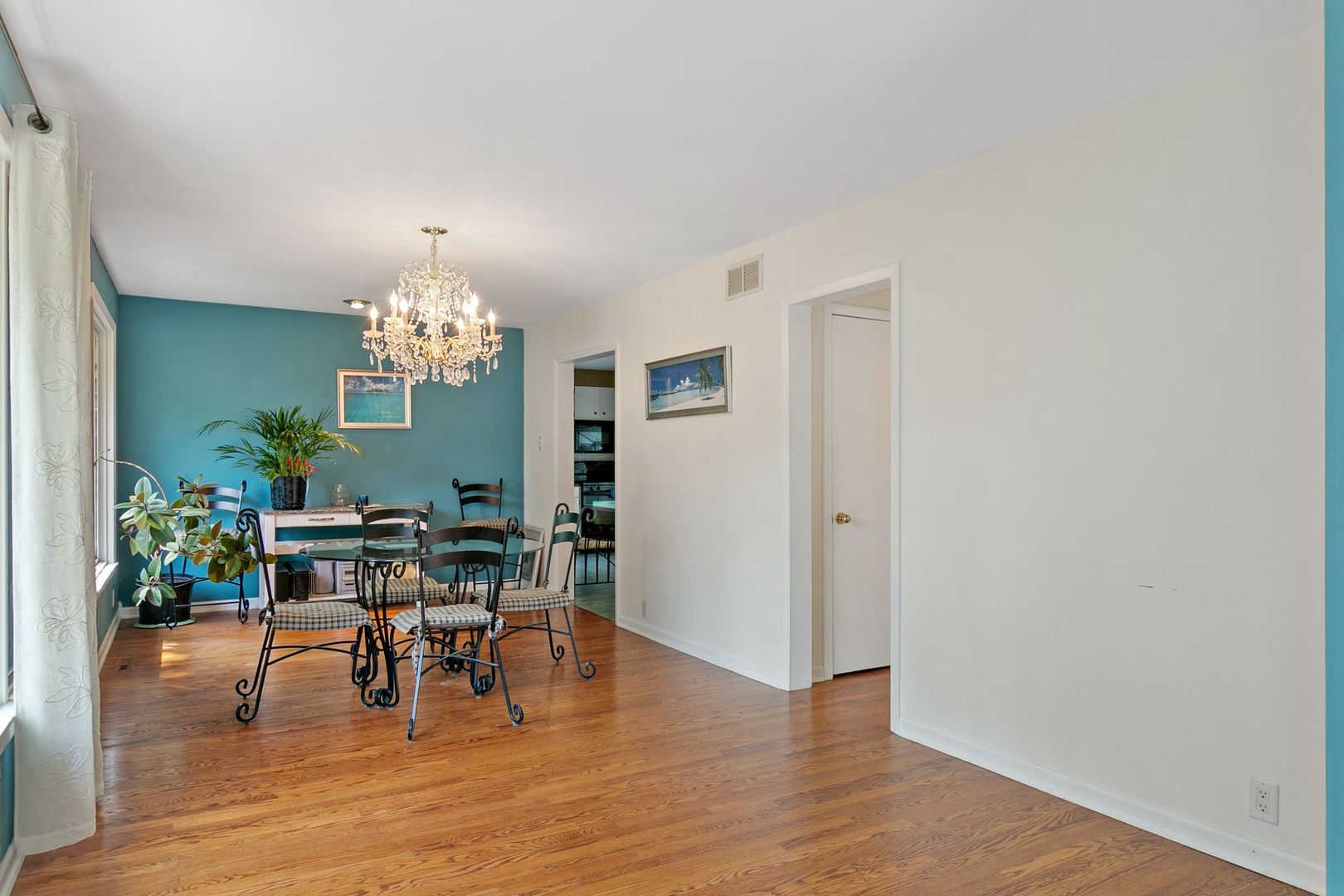 905 Ridge Avenue Wauconda, IL 60084 - Photo 9 of 27 a view of a dining room with furniture and chandelier