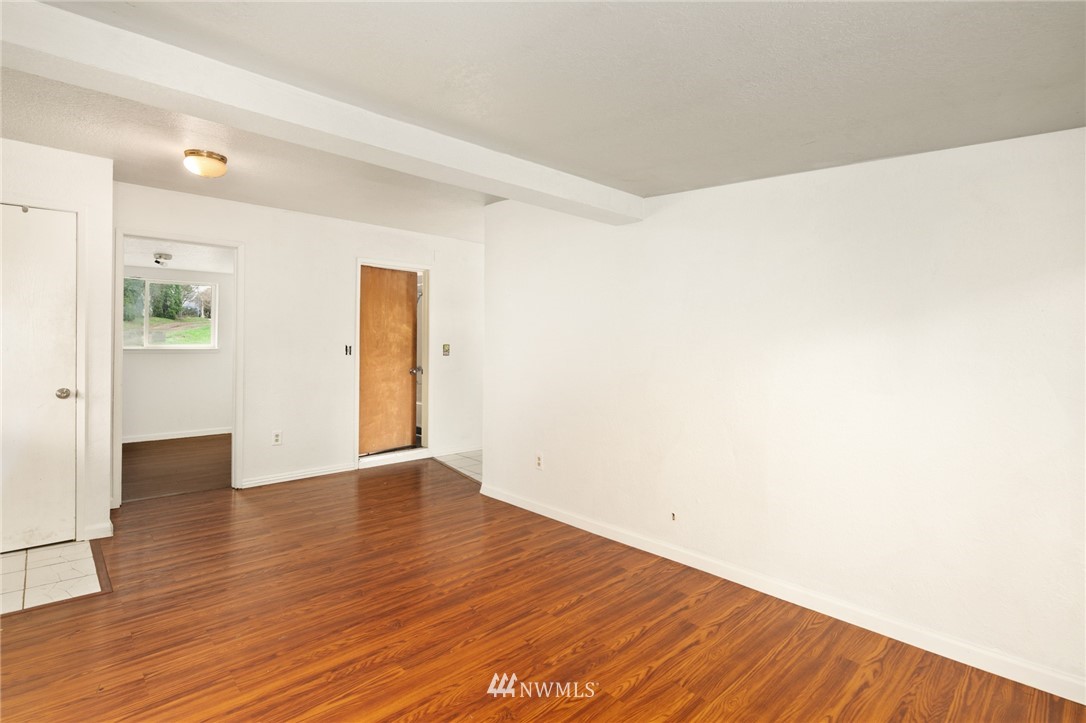 226 South 15th Street Renton, WA 98055 - Photo 4 of 28 a view of an empty room with wooden floor