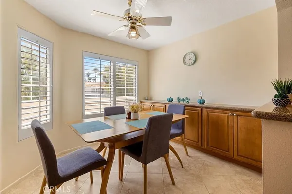 a view of a dining room with furniture window and outside view