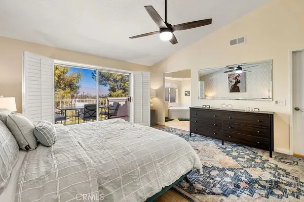 a bedroom with a bed dresser and a window