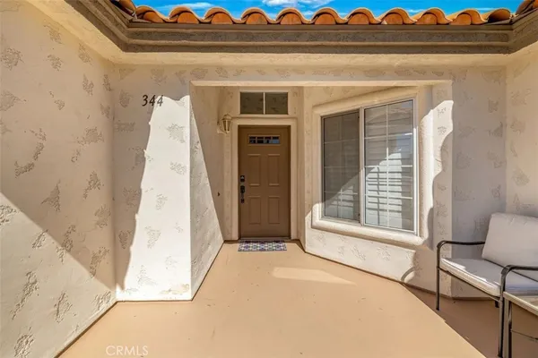 a view of a bedroom with wooden floor and a bed