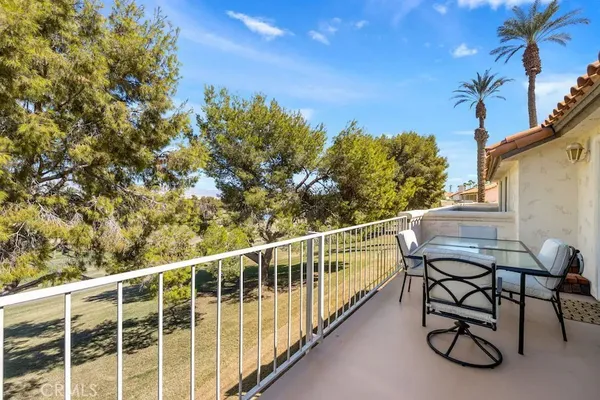 a view of a balcony with chairs