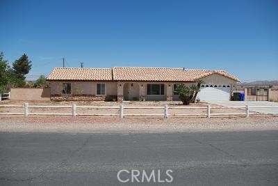 21030 Zuni Road Apple Valley, CA 92307 - Photo 1 of 1 a view of a white house with a street