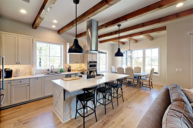 a bathroom with a granite countertop shower and a mirror