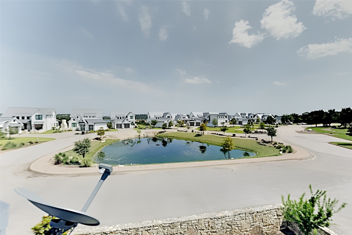 19517 Flying J Boulevard, Unit 6 Spicewood, TX 78669 - Photo 29 of 32 a view of a swimming pool and outdoor seating