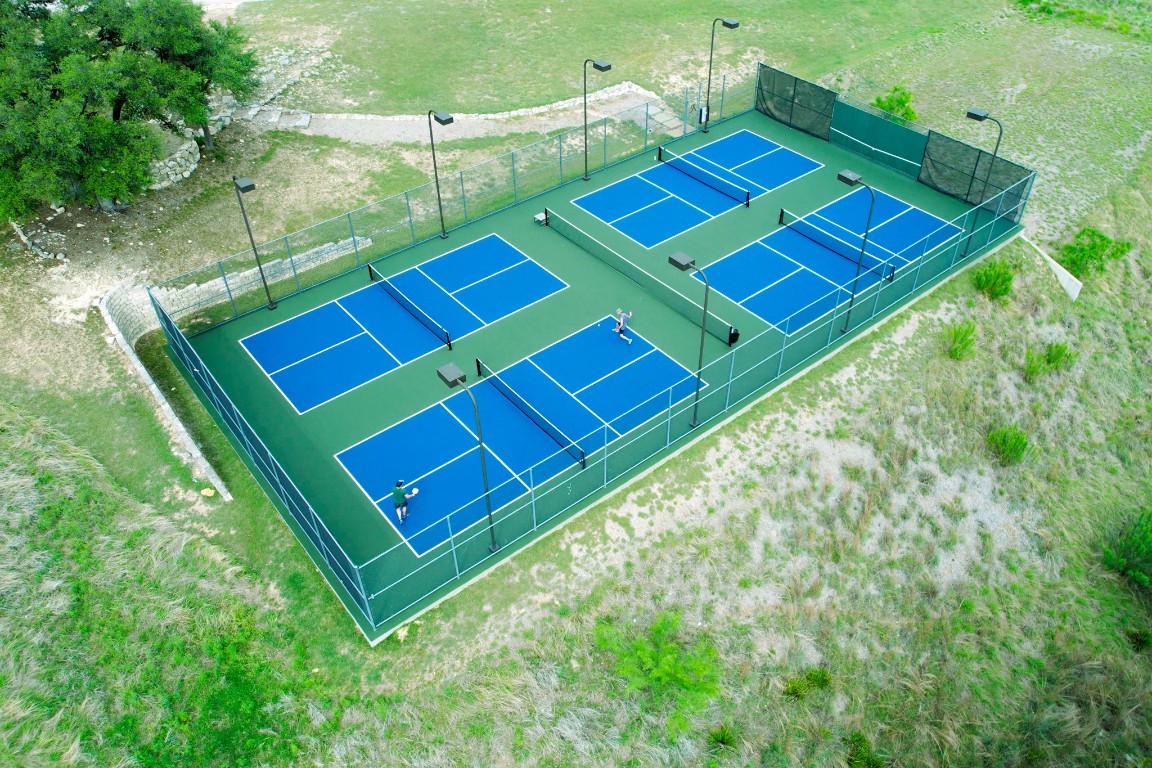 19517 Flying J Boulevard, Unit 6 Spicewood, TX 78669 - Photo 31 of 32 a view of a yard with a backyard