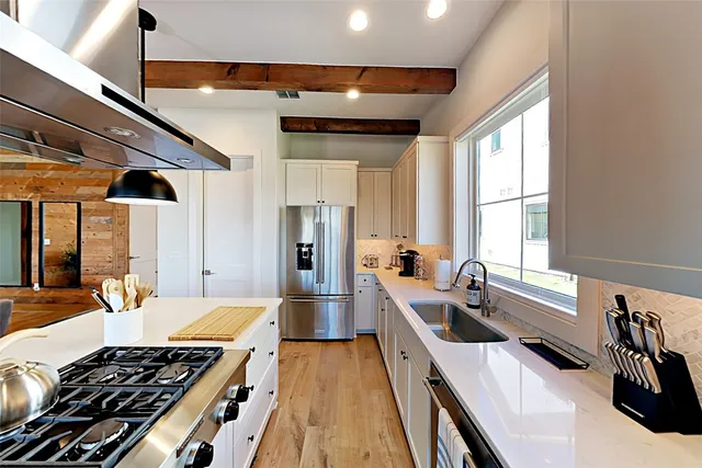 a balcony with furniture and floor to ceiling window