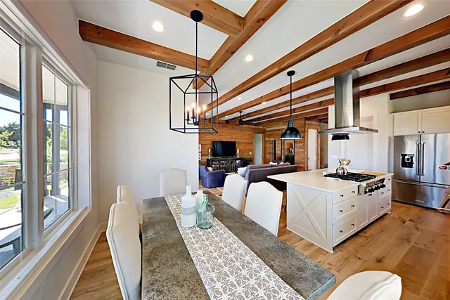 a view of a dining room with furniture window and outside view