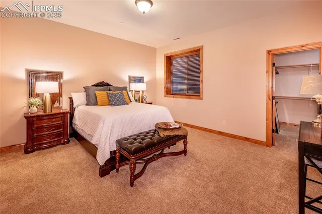 a bedroom with a bed and a cabinets