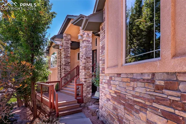 front view of a house with a bench