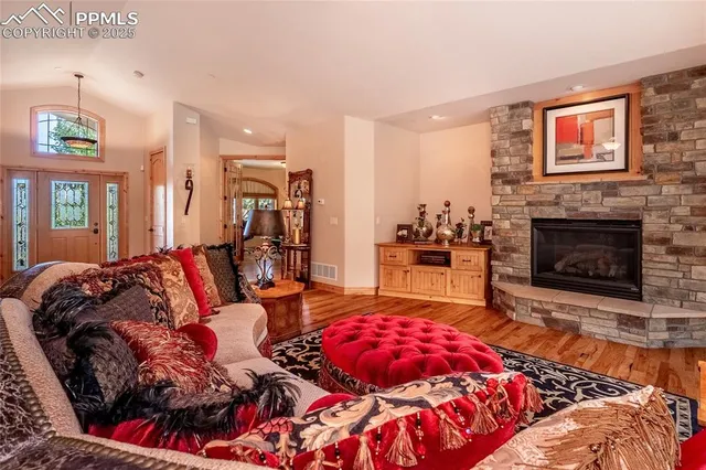 a living room with furniture and a fireplace