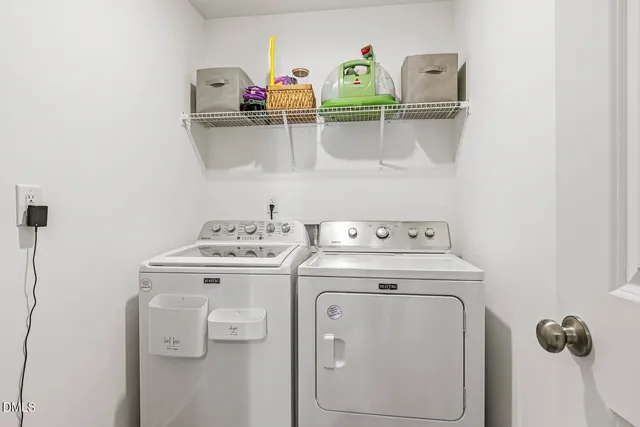 a bedroom with a bed a mirror and a window