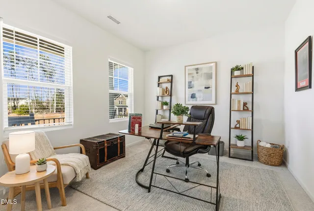 a view of a hallway with paintings on the wall