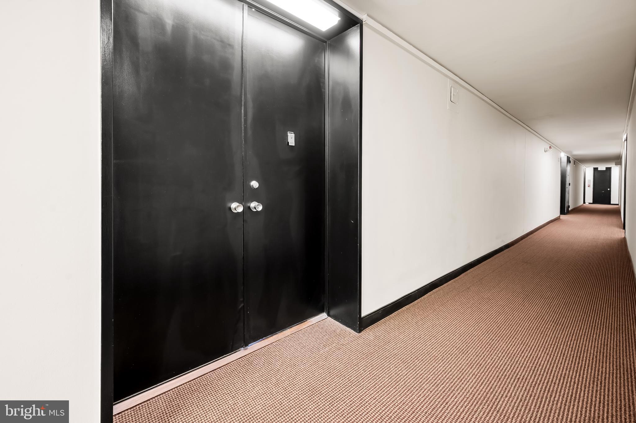 4000 North Charles Street, Unit 1605 Baltimore, MD 21218 - Photo 11 of 45 a view of hallway