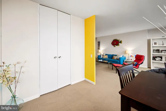 a kitchen with stainless steel appliances granite countertop a stove a refrigerator and a dining table