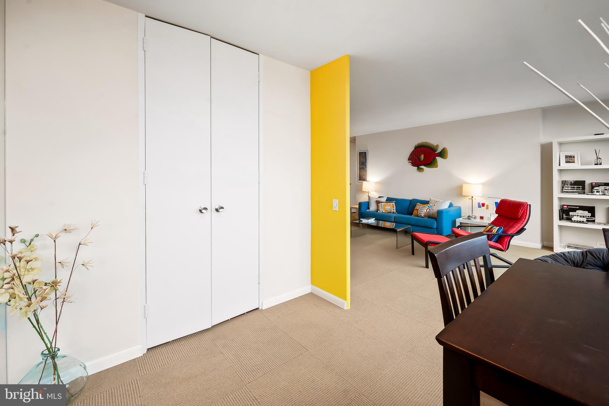 4000 North Charles Street, Unit 1605 Baltimore, MD 21218 - Photo 16 of 45 a living room with furniture and a table