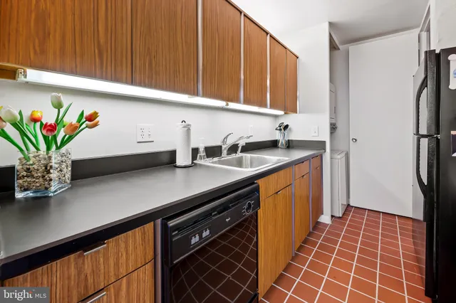 a stove top oven sitting inside of a kitchen