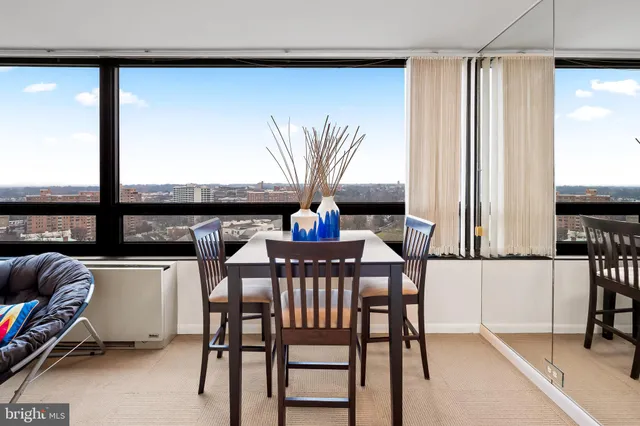 a dining room with furniture and window