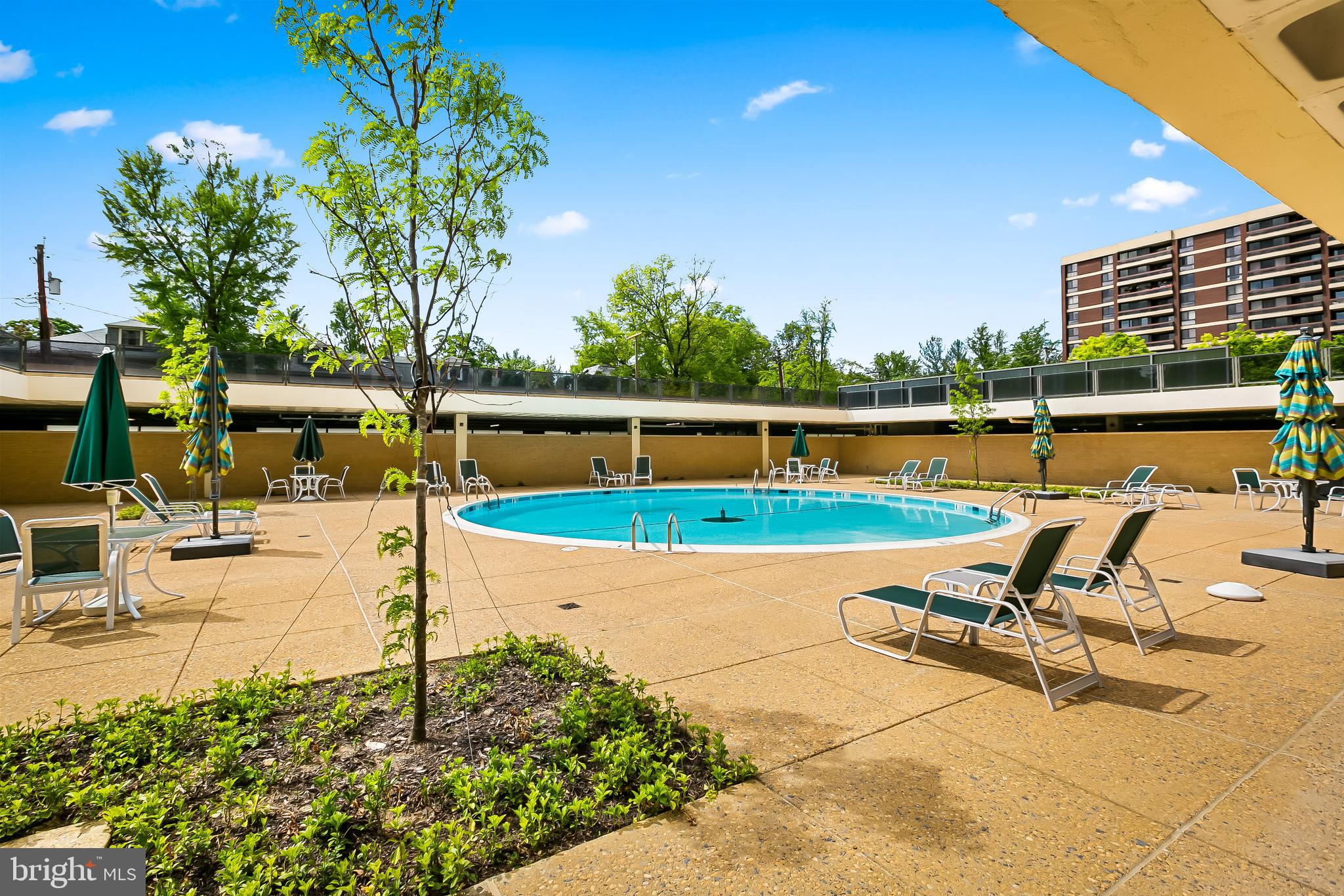 4000 North Charles Street, Unit 1605 Baltimore, MD 21218 - Photo 44 of 45 a view of a swimming pool with a patio