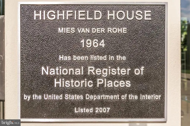 a front view of a building with a yard