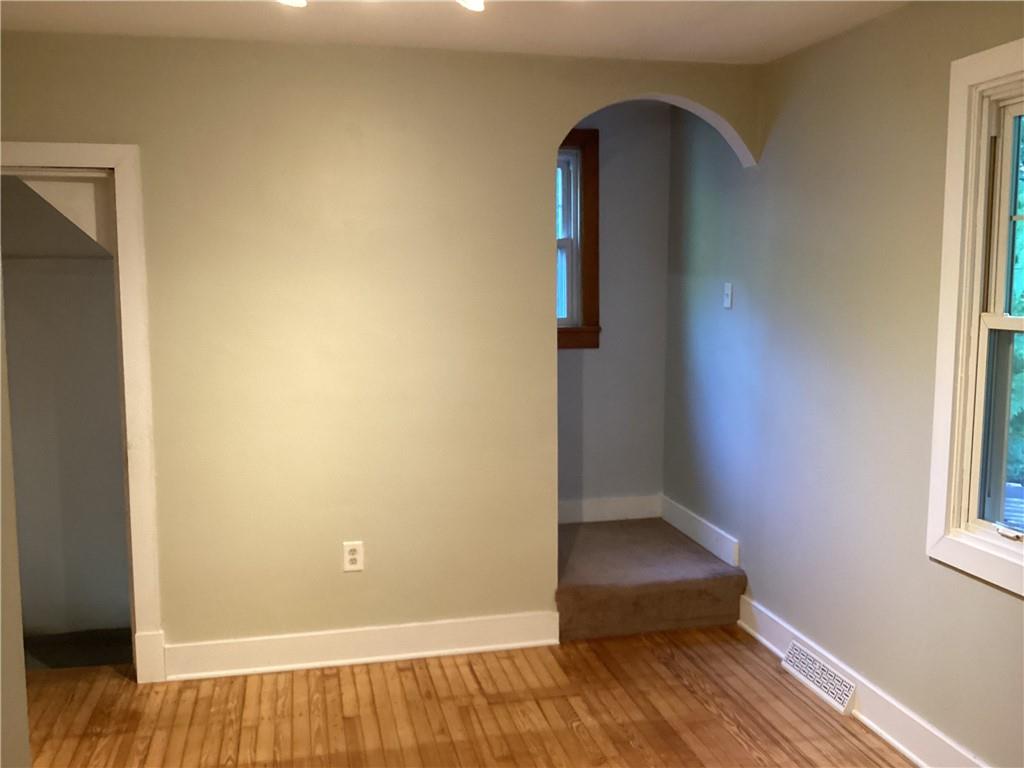 479 Crawford Run Road Creighton, PA 15030 - Photo 13 of 50 an empty room with wooden floor and windows