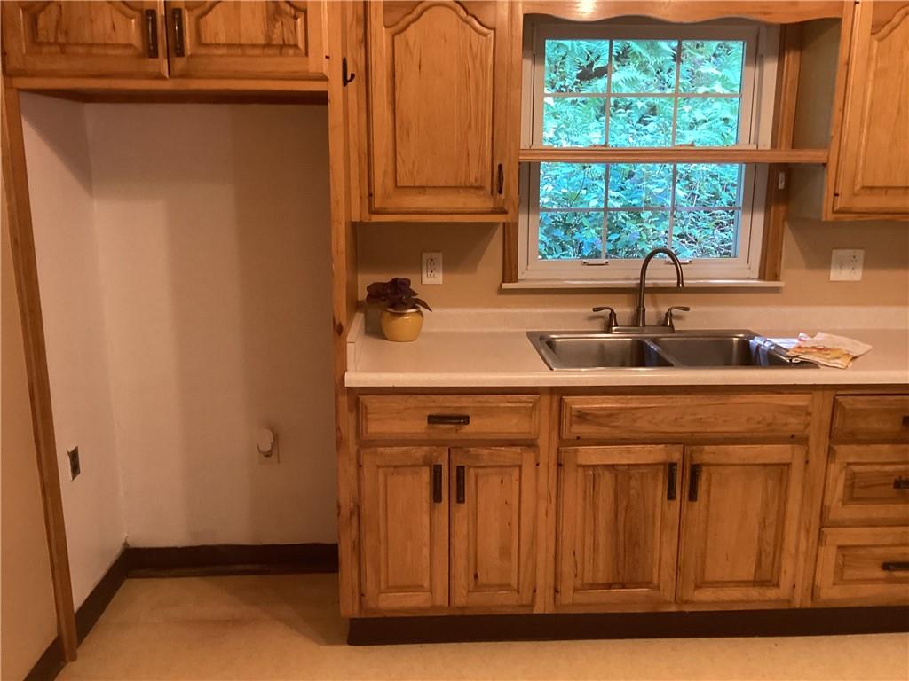 479 Crawford Run Road Creighton, PA 15030 - Photo 15 of 50 a kitchen with a sink and cabinets
