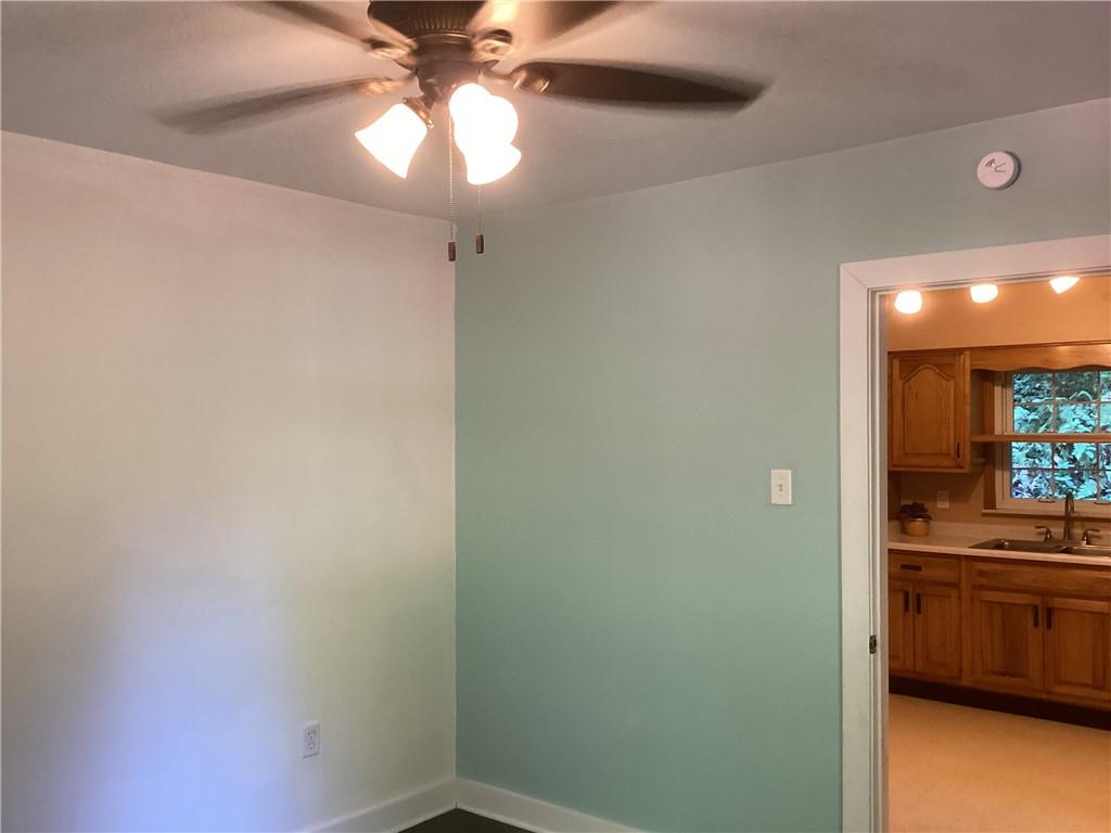 479 Crawford Run Road Creighton, PA 15030 - Photo 33 of 50 a view of a room with a ceiling fan and wooden floor